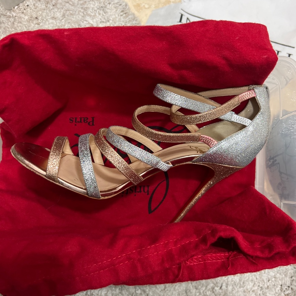 In great used condition these Christian Louboutin gladiator glitter heels.